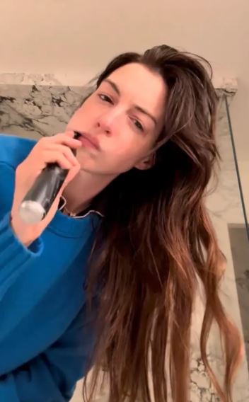 Anne Hathaway Heads to Work in Cerulean Sweater for ‘The Devil Wears Prada 2’ 1 Anne Hathaway Heads to Work in Cerulean Sweater for ‘The Devil Wears Prada 2’