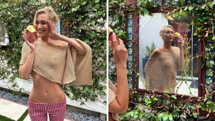 Bella Hadid Stuns in Sheer Cropped Shawl for Perfume Event