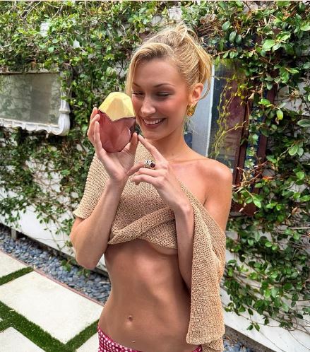 Bella Hadid Stuns in Sheer Cropped Shawl for Perfume Event