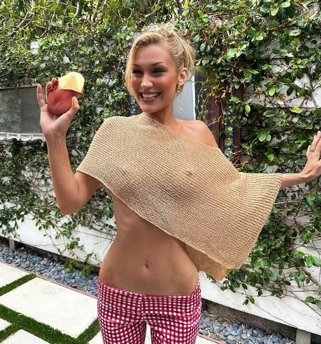 Bella Hadid Stuns in Sheer Cropped Shawl for Perfume Event